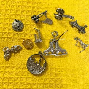 Set 10 varied silver charms cannon, skates, ski, bridge, travel bracelet vintage